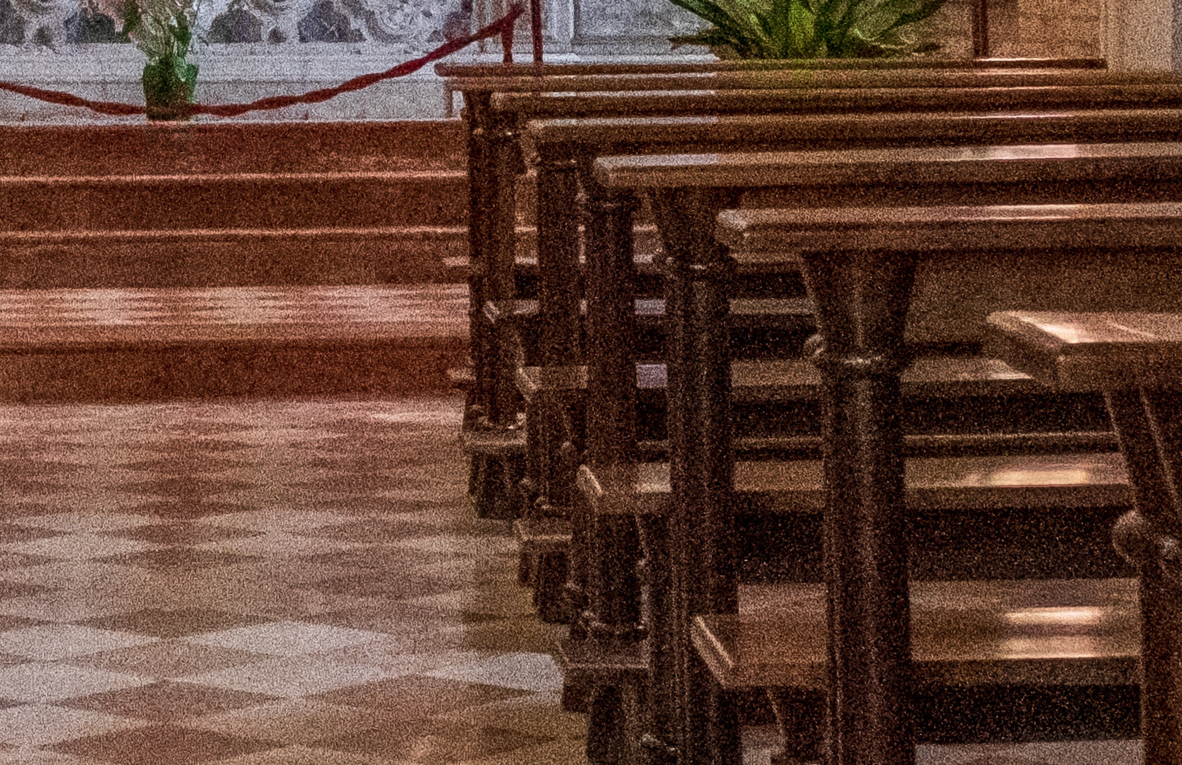 A interior photo of a church with lots of visible noise from using a high ISO.